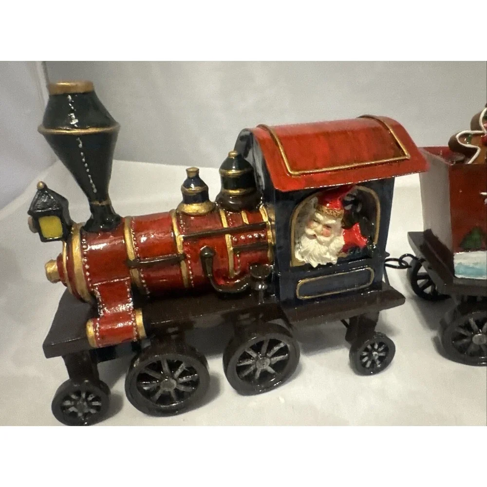 Sterling 3 Piece Resin  Santa,‎ Snowman and Tree Christmas Train Set.